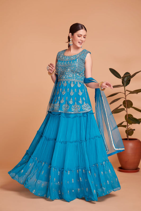 Cerulean blue colored short peplum crop top lehenga with embroidery work