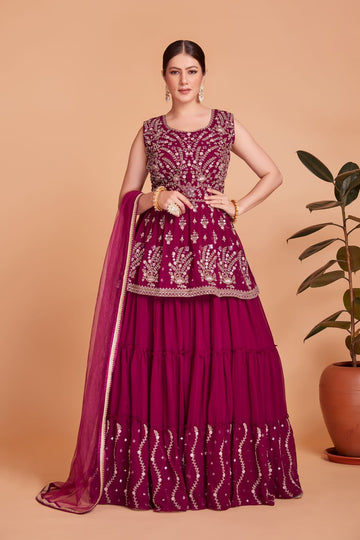 Rani pink party wear side cut peplum crop top lehenga with heavy embroidery work